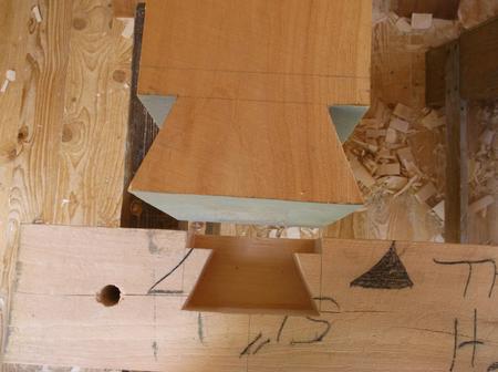Housed dovetail tenon on loft tie beam & dovetail mortise in wall log.