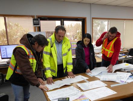 Photo of Construction Management Team Members Collaborating