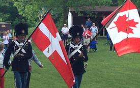 Danish guards carrying Danish & Canadian flags