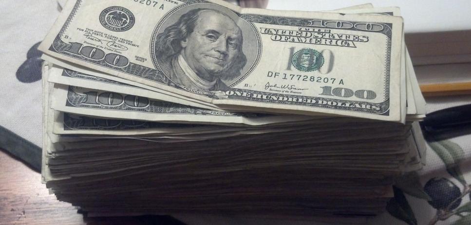 Stacks of USD $100 bills