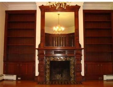 new bookcases and ornate fireplace mantle and tiled surround designed and built by Adelphia Contracting, Norton, MA.
