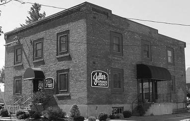 Black and White photo of Fuller Insurance Agency office building in Carthage, NY