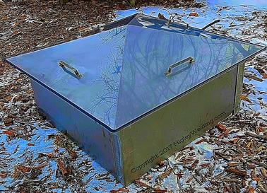 alt="sloped stainless steel fire pit cover"