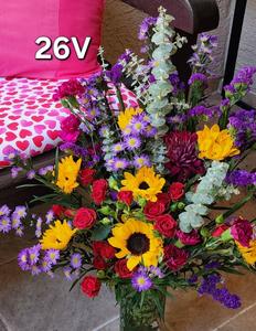 beautiful valentines day flower vase with gorgeous yellow mini-sunflowers, purple and blue flowers and small red roses with greenery