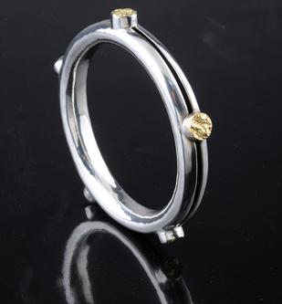 anticlastic Sterling silver and gold leaf bracelet by Kevin O'Dwyer.