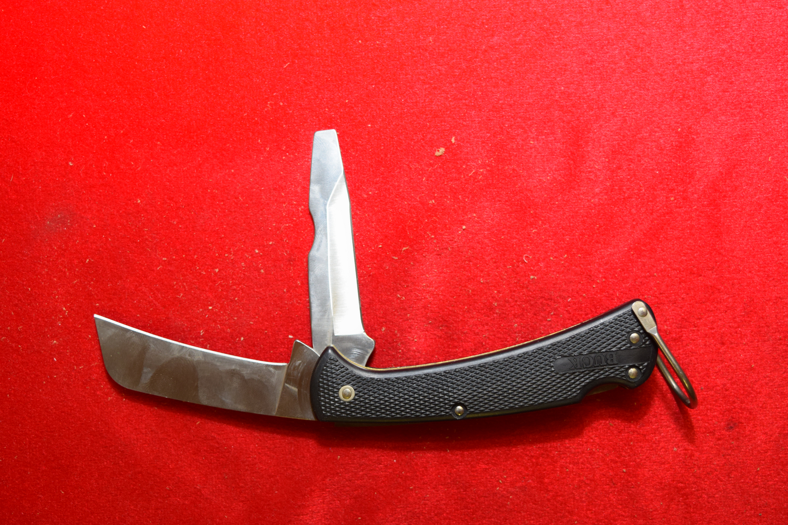 Sold at Auction: Buck 110 & Cooking Guild Knives, Scope, Cleaning