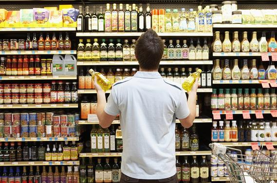 Men at the supermarket confuse on what oil is the best for cooking