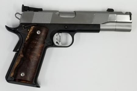 Custom 1911 with stainless STI barrel and stainless Caspian slide, black Caspian frame and custom wood grips. Custom compensater in stainless to match barrel and slide. Trik trigger and custom Koa grips