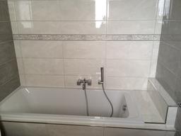 newly tiled bath tub surround