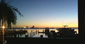 Sunset over dock and Atlantic City skyline