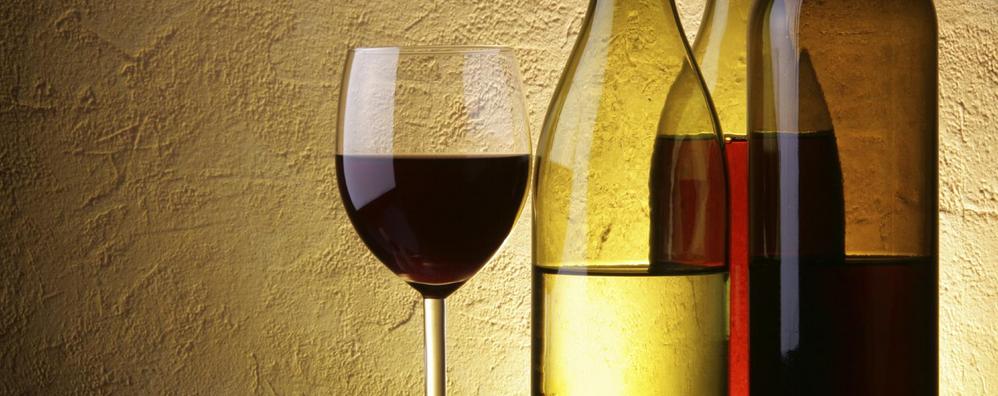 White and Red wine bottles with a glass of red wine