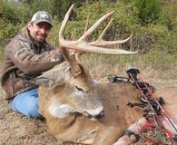 Whitetail deer hunter with bow