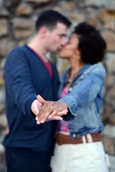 engagement photo hands in focus held out showing ring Monterey Bay couples engagement photographer