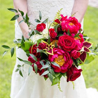 bridal bouquet being held in front of bride
