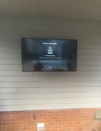 4k ultra HD TV mounted out doors on patio, Charlotte NC Flat Screen TV Wall Mount serves and installation