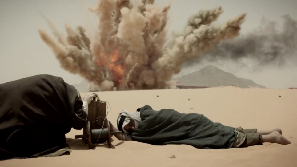 Lawrence of arabia and arab bedouin soldier blowing up a turkish train