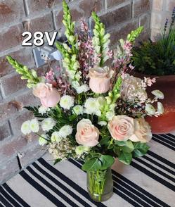 beautiful valentines day flower bouquet with white small flowers and light pink high quality roses with white stems and greenery