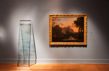 Dawn DeDeaux's Water Marker sculpture installed in an exhibition next to French Baroque painter Claude Lorrain masterpiece painting of a river running through a landscape.