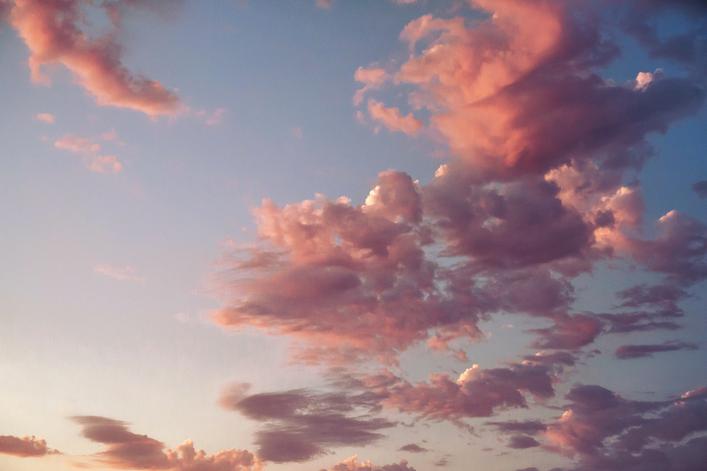 beautiful pink sunset clouds over blue sky