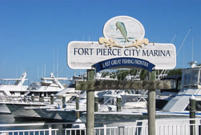 Picture of boats and the sign for the Fort Pierce City Marina