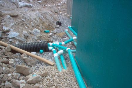 Waterproofed concrete walls and footing drains