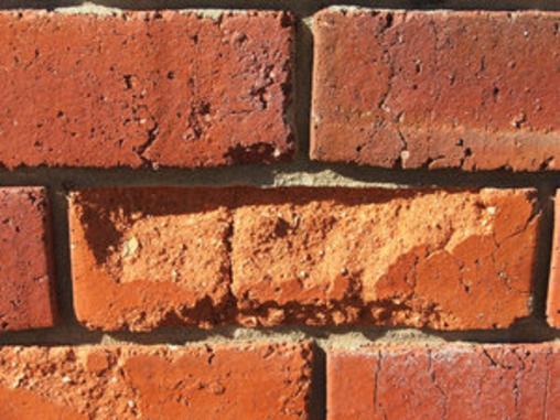 Damaged brick from tuckpointing