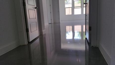 polished concrete hallway going in to bedroom