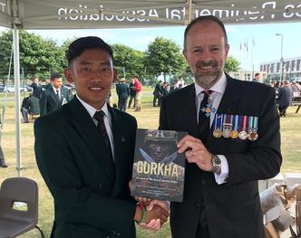 Craig Lawrence author of the new Gurkha RGR25 book with Rifleman Ekbahadur Gurung whose face is on the cover
