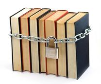 Image of a stack of books with a chain and padlock around them