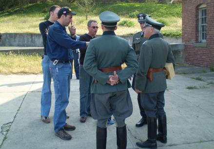 Tech Advisor and Director go over scene with WW2 German Officers