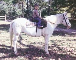 Colby's Army photo of Colby Keegan riding a white Apaloosa mare, horse