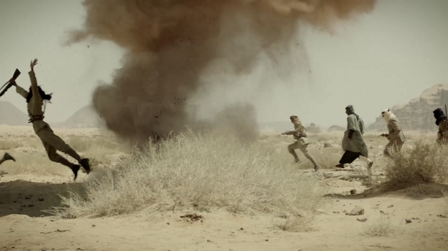 artillery ground explosion and stuntmen in Jordanian desert