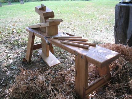 Shaving horse built from oak tie beam, salvaged from an 1840's barn. Used for final shaping of pegs.