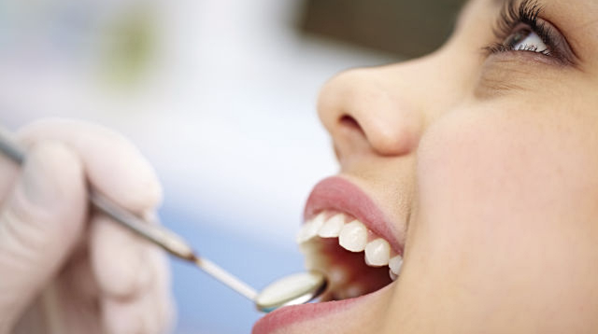 A girl getting a check-up from a general dentist in Catonsville, MD