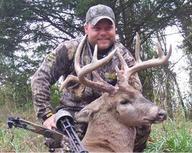 Whitetail deer hunter with bow