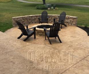 Seamless Italian Slate stamped concrete patio in wheat integral color with mojave antique featuring Belvedere paver sitting wall and fire pit