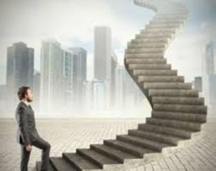 Graphic image of a business man in a gray business suit taking the 1st step forward onto a tall concrete corporate stairway that is shown leading up and forward to the sky. Backdrop shows tall city skyscraper scene.