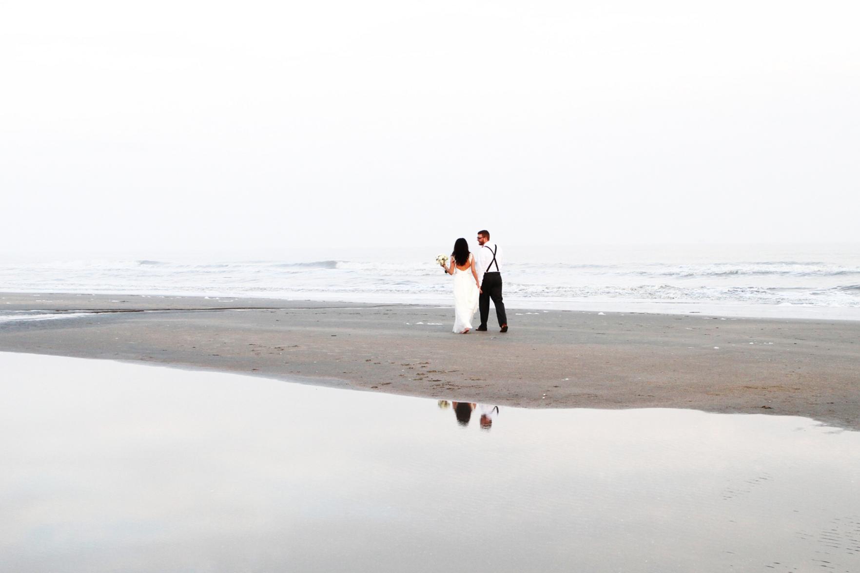 Couple on beach after elopement ceremony on Isle of Palms, SC