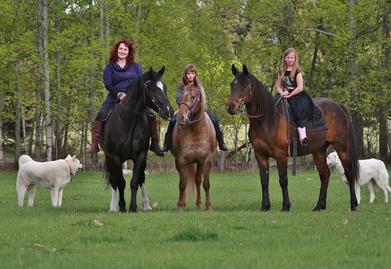 three people on horseback