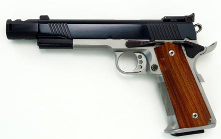 1911 Custom built handgun with black STI barrel and black Caspian slide, stainless Caspian Race Ready frame, Ed Brown trigger and custom wood grips