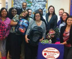 Colby's Army photo of volunteers filling backpacks for the homeless