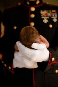 newborn photography military father with white gloves holding baby head newborn photography Monterey Bay California