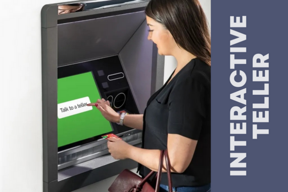 A person selecting the "talk to a teller" on an NCR Interactive Teller Machine