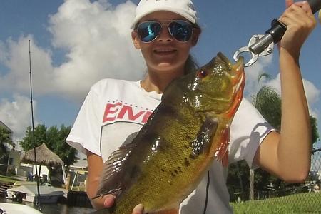 Young female angler with Peacock Bass