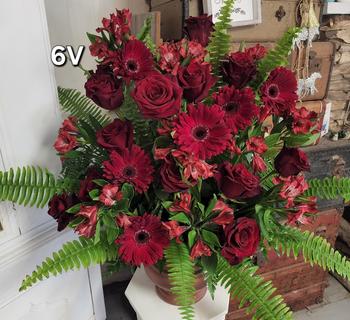 Classic fresh flower valentines day flower arrangement for helotes texas with deep dark red roses, dark red flowers and vibrant greenery