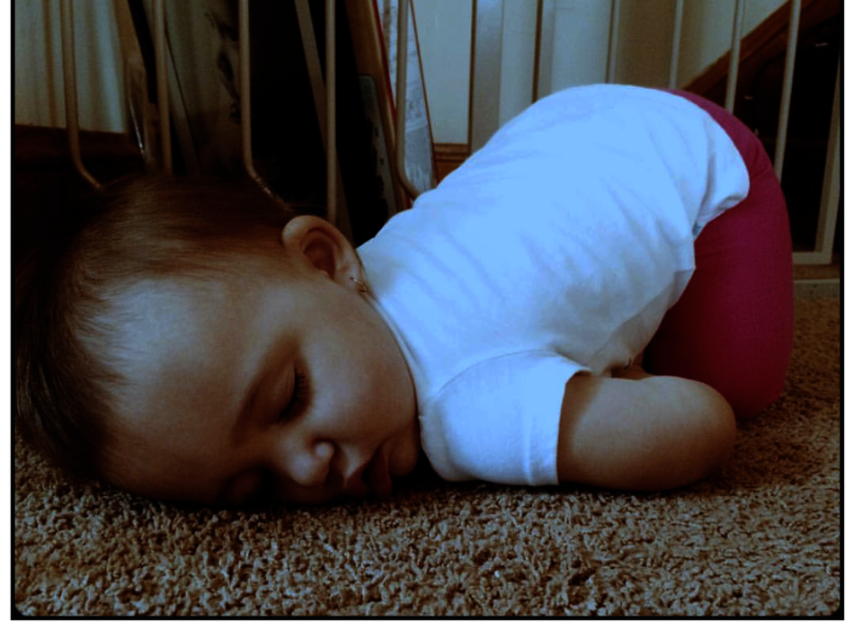baby sleeping on clean carpet