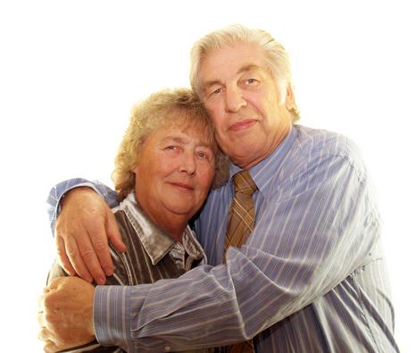 alt="Older Couple Hugging and feeling safe"