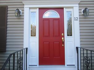 exterior front door after being painted red.