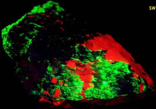 fluorescing CALCITE, WILLEMITE with FRANKLINITE, ZINCITE - Sterling Mine, Sterling Hill, Ogdensburg, Franklin Mining District, Sussex County, New Jersey, USA - type locality