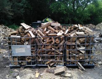 Firewood in bins for pick up in Mount Albert